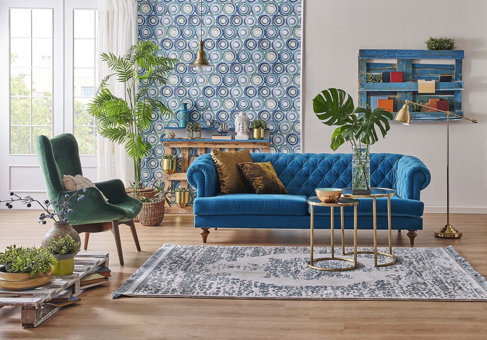 blue couch and green armchair on a patterned rug from from Lonsdale Flooring in Vancouver, BC